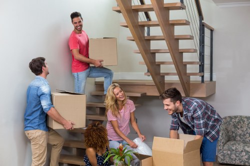 Student removals team packing boxes in Homerton