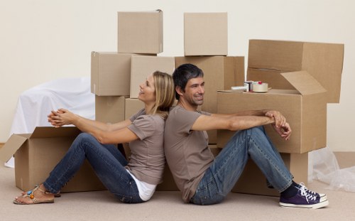 Professional moving truck service handling boxes and furniture