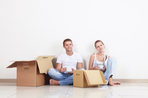 Professional movers handling furniture during a Homerton house removal