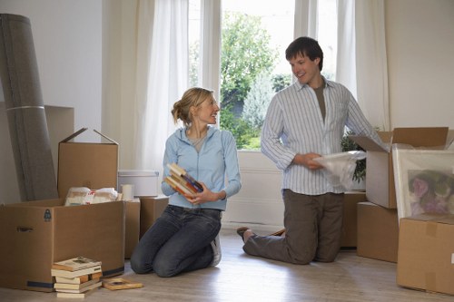 Professional movers loading office assets during a Homerton relocation