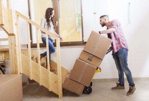 Packed boxes and furniture prepared for a local move in Homerton