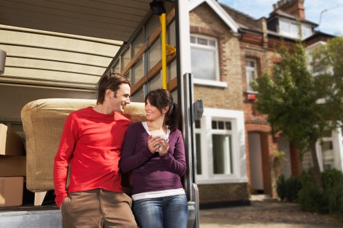 Family settling into a new home after house removals in Homerton
