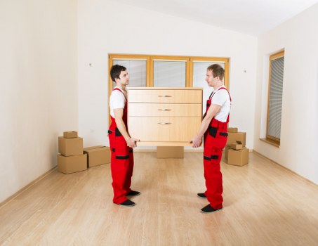 Professional office movers handling desks and office furniture in Homerton