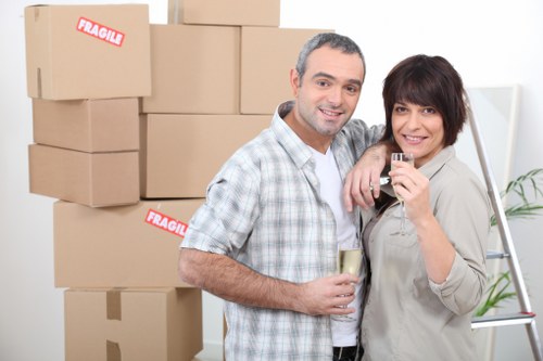 PPE-equipped moving team protecting belongings during transport